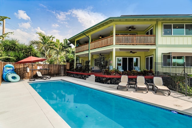 view of swimming pool featuring a patio and ceiling fan