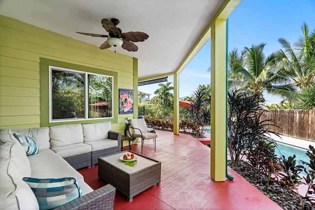 sunroom featuring ceiling fan