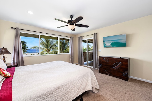 carpeted bedroom with access to exterior and ceiling fan