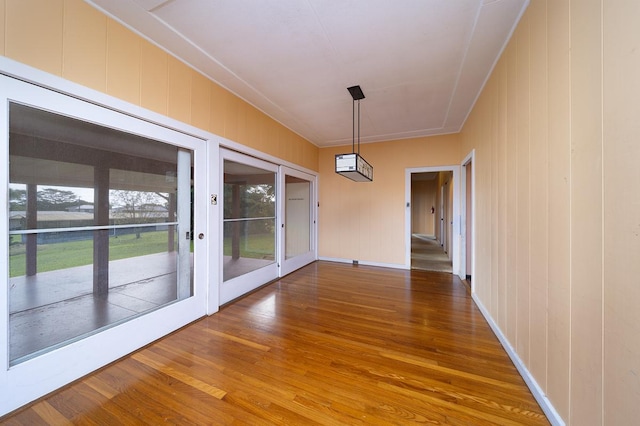 unfurnished dining area with hardwood / wood-style floors