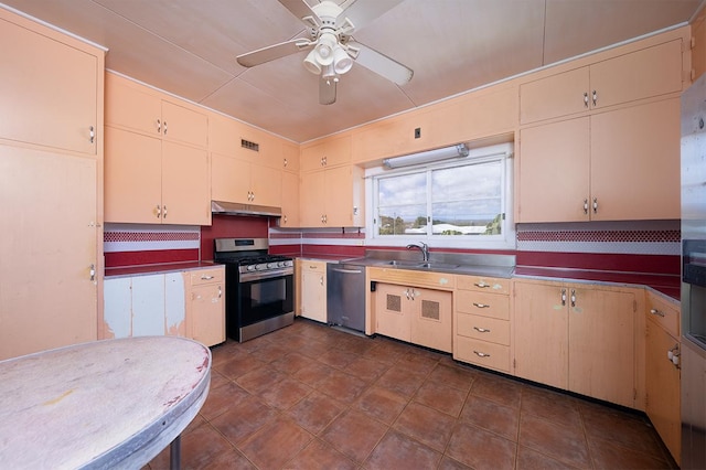 kitchen with sink, stainless steel counters, ceiling fan, stainless steel appliances, and decorative backsplash