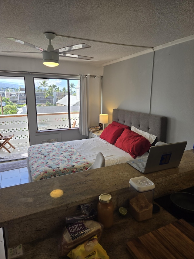 bedroom with a textured ceiling and ceiling fan