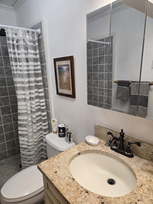 bathroom with curtained shower, toilet, vanity, and ornamental molding