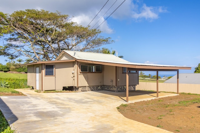 exterior space featuring a carport