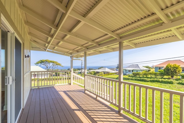 wooden deck featuring a yard