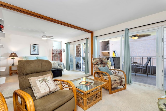 carpeted living room featuring ceiling fan