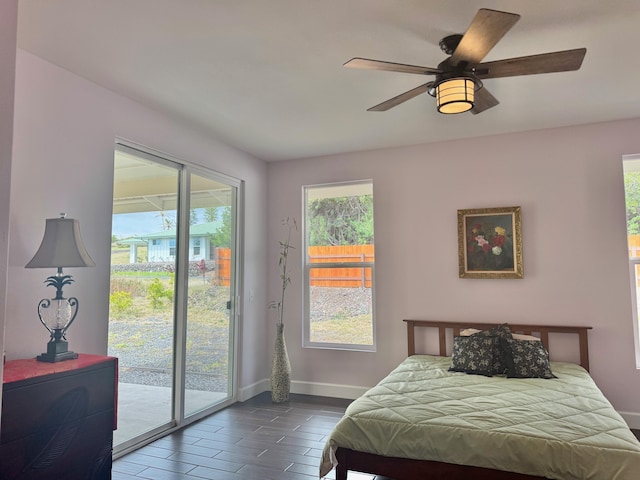 bedroom featuring ceiling fan, access to outside, and dark hardwood / wood-style flooring