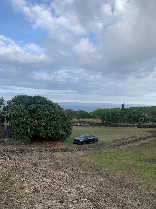 view of yard with a rural view