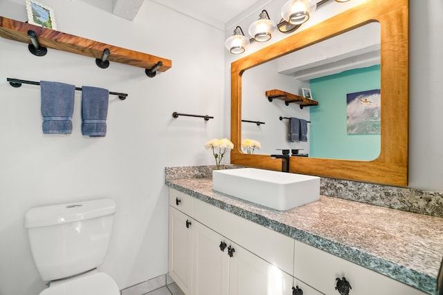 bathroom with toilet and vanity