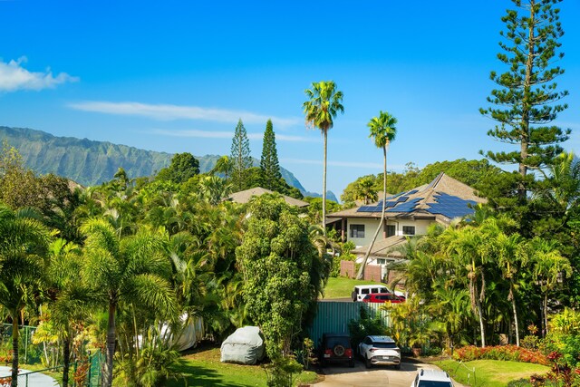 view of community featuring fence and a mountain view