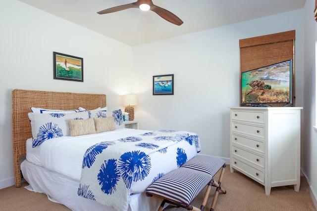 bedroom with light carpet and ceiling fan