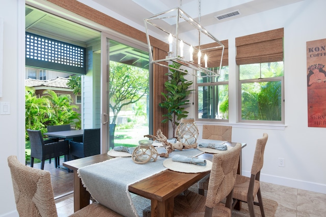 dining space with a chandelier