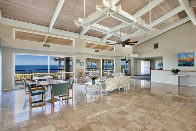 living room featuring a water view, wood ceiling, beamed ceiling, ceiling fan with notable chandelier, and a high ceiling