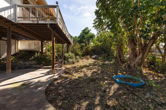 view of yard with a patio area and a deck