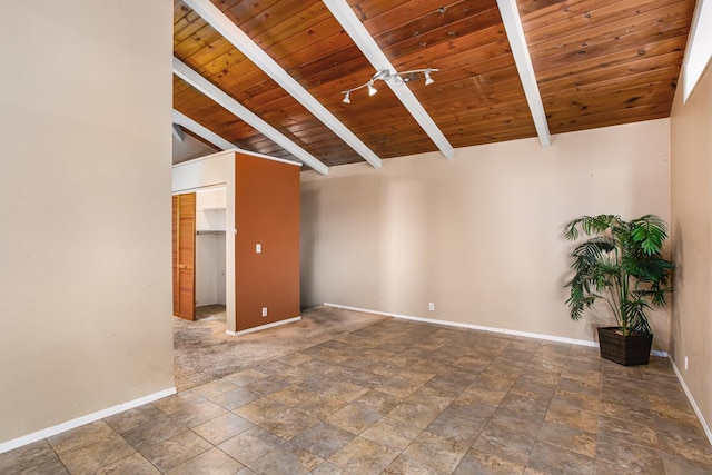 unfurnished room with lofted ceiling with beams, ceiling fan, and wood ceiling