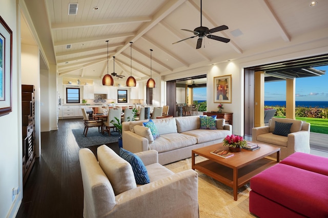 living room featuring ceiling fan, lofted ceiling with beams, and hardwood / wood-style floors