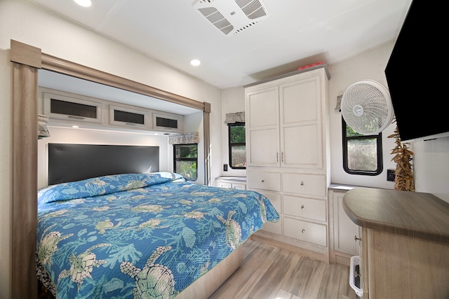 bedroom with light hardwood / wood-style flooring