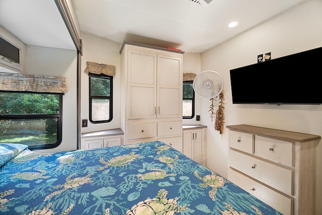 bedroom featuring multiple windows