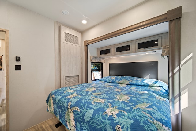 bedroom featuring wood-type flooring