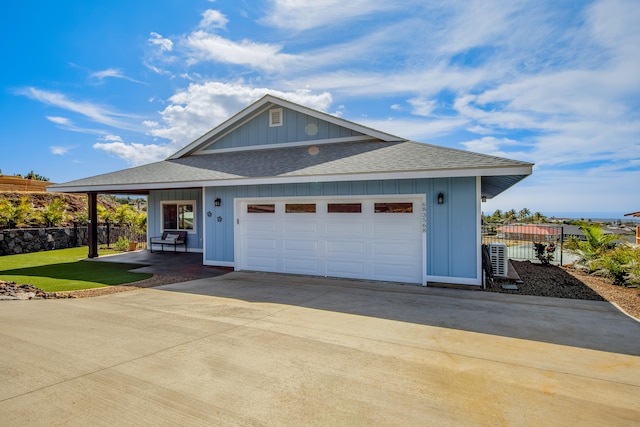 view of front of property featuring a garage and a front yard