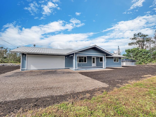 view of front of property with a garage and a porch