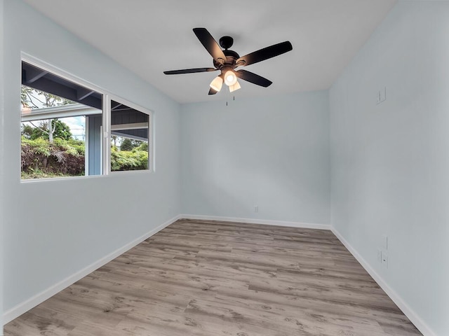 empty room featuring ceiling fan and light wood-type flooring