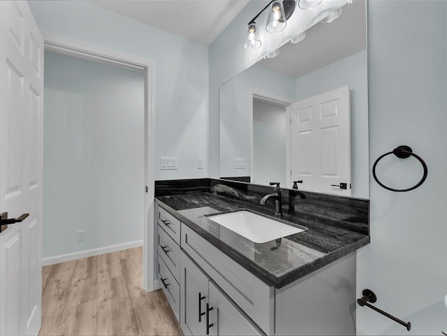 bathroom with vanity and wood-type flooring