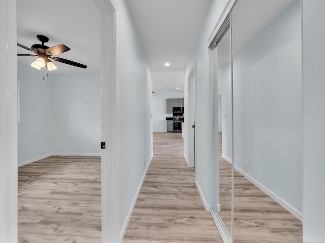 hall with light wood-type flooring