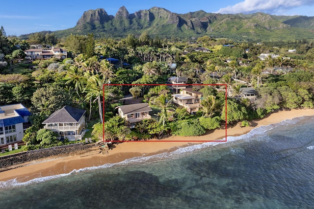 bird's eye view with a view of the beach and a water and mountain view