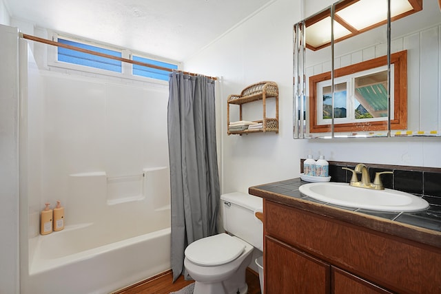 full bathroom with shower / bath combination with curtain, vanity, and toilet