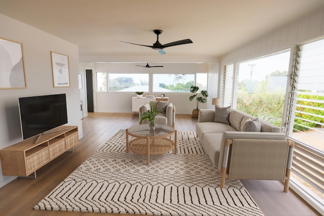 living room featuring dark hardwood / wood-style floors and ceiling fan