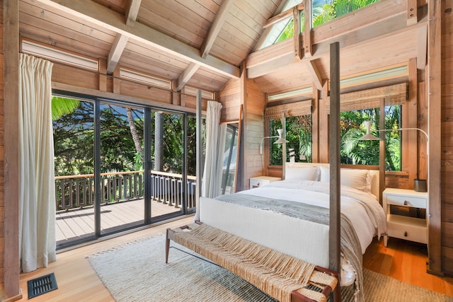 bedroom with access to outside, light wood-type flooring, wooden ceiling, vaulted ceiling with beams, and wood walls