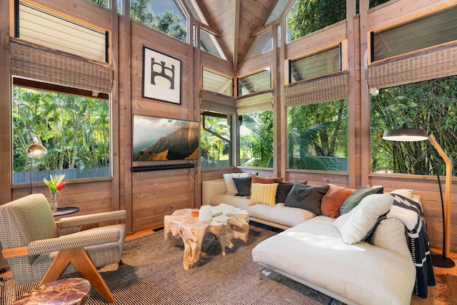 sunroom featuring vaulted ceiling