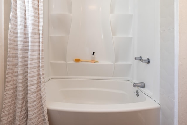 bathroom featuring shower / tub combo with curtain