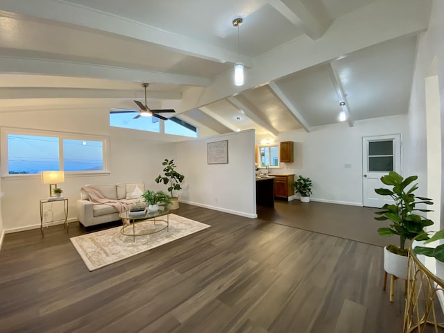 living room featuring lofted ceiling with beams, dark wood-type flooring, and ceiling fan