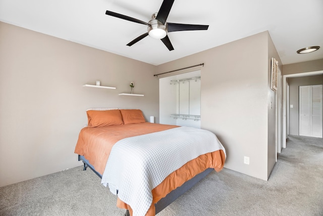 bedroom featuring light carpet and ceiling fan