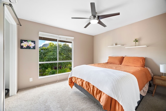 bedroom with ceiling fan and carpet floors