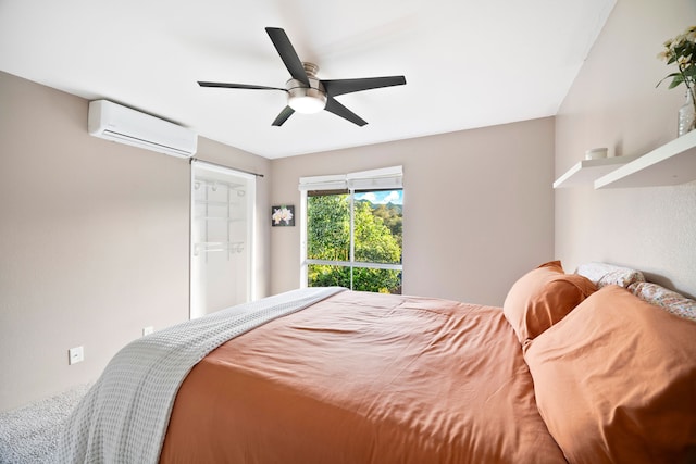 bedroom with a wall mounted air conditioner and ceiling fan