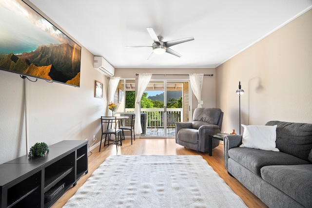 living room featuring ceiling fan, light hardwood / wood-style flooring, and an AC wall unit