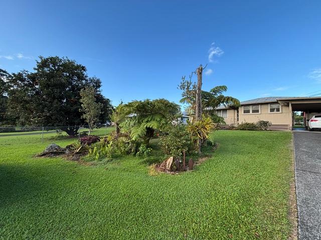 view of yard with a carport