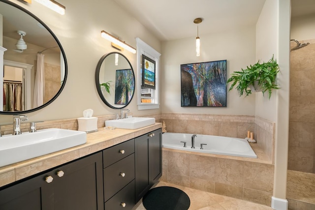 bathroom featuring tile patterned floors, plus walk in shower, and vanity