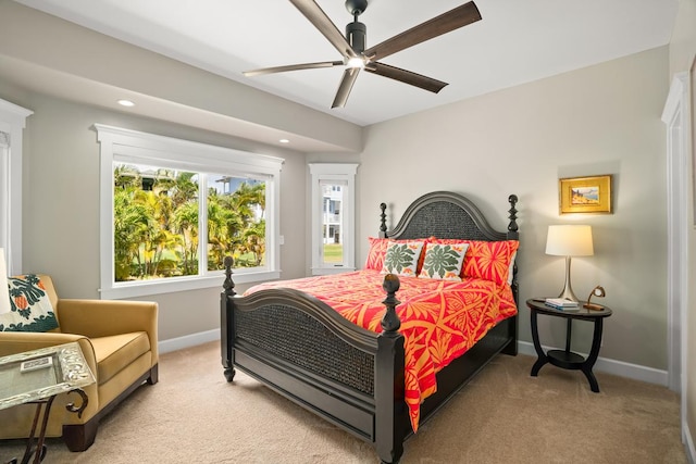 bedroom featuring light carpet and ceiling fan