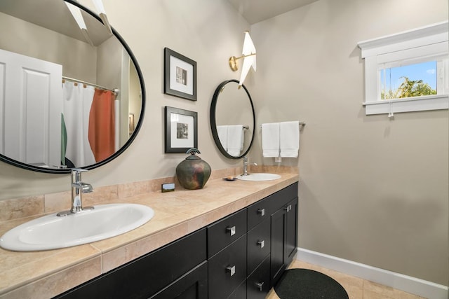 bathroom with vanity and tile patterned flooring