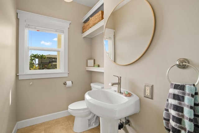 bathroom featuring tile patterned flooring, sink, and toilet