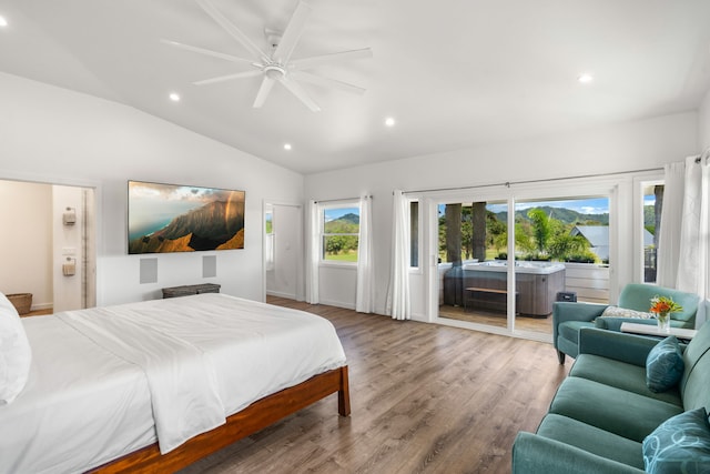 bedroom featuring ensuite bathroom, vaulted ceiling, access to outside, ceiling fan, and light hardwood / wood-style floors