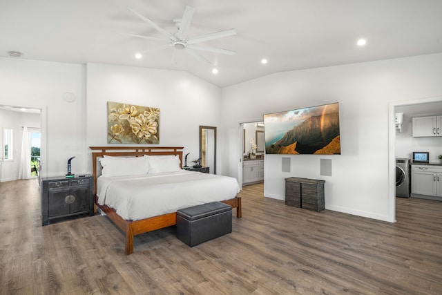 bedroom featuring dark hardwood / wood-style flooring, washer / clothes dryer, lofted ceiling, and ceiling fan