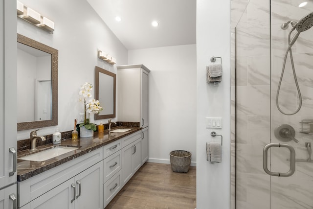 bathroom featuring vanity, hardwood / wood-style floors, and walk in shower