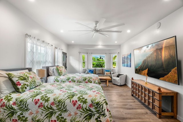 bedroom featuring light hardwood / wood-style floors and ceiling fan