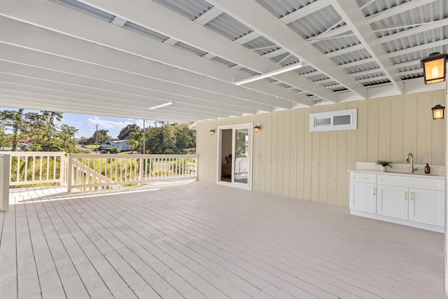 wooden deck featuring sink