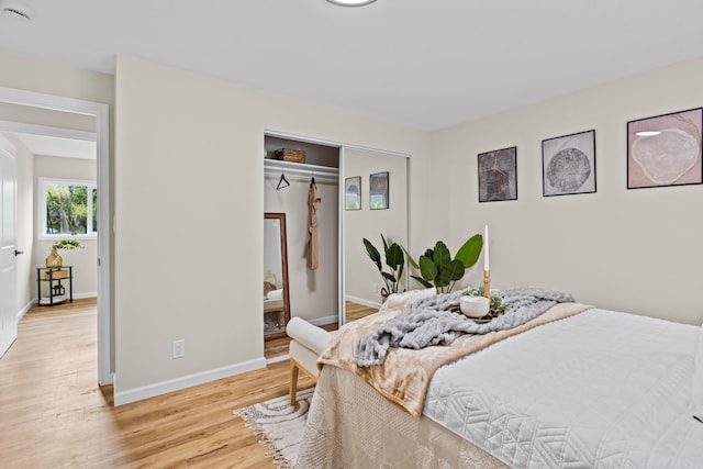 bedroom featuring a closet and light wood-type flooring